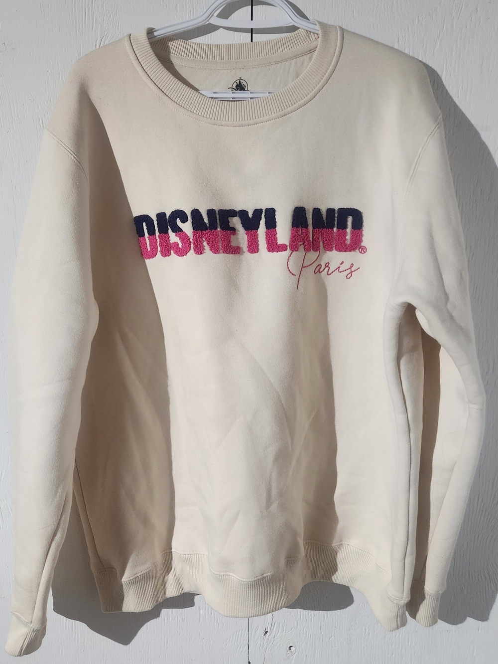 Disney Cream Crewneck Sweatshirt with Navy and Pink Logo